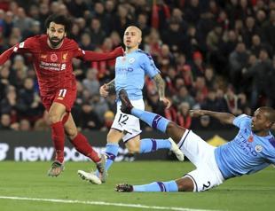 Liverpool beat Man City to extend lead on top