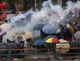 Hong Kong police battle protesters trying to escape arrest