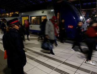 Striking unions cripple Paris in stand-off with Macron