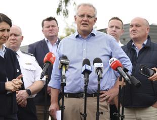 Under pressure Australia PM visits beleaguered firefighters
