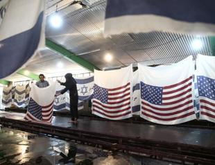 Iranian factory makes US and Israeli flags to burn