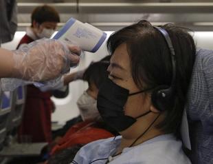 Hong Kong records first virus death, Macau shuts casinos