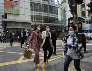 Fear of coronavirus pandemic grows but China eases curbs as new infections fall