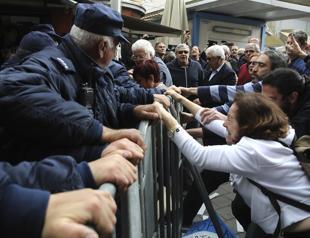 Turkish, Greek Cypriots push aside barriers in divided Nicosia