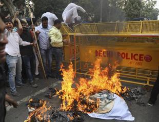 Indian lawmakers scuffle over citizenship riots where 41 died