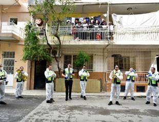 Marching bands perform on streets to boost locals’ morale