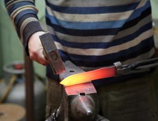 Veteran officer makes historical war tools in workshop