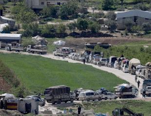 Over 100,000 Syrians in Idlib border camps return to their homes