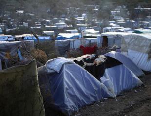 Extensive damage at Greek migrant camp after fire, protests