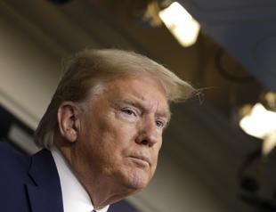 Trump bars new immigration green cards, not temporary visas