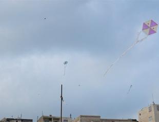 Residents fly colorful kites from rooftops in Turkey’s Mardin