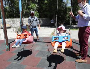 Turks under 14 venture out for four hours as virus rules ease