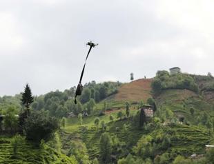 Village head uses drone to distribute face masks to residents