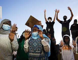 Officer charged with murder of black American as protests sweep US