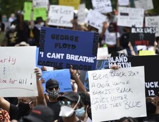 Protests over police killings rage in dozens of US cities