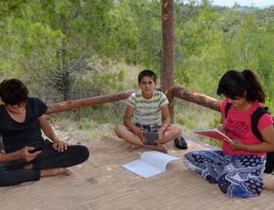 Children trek 4 km in Taurus Mountains every day to pick up signal for online classes