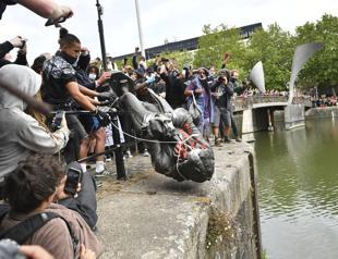Slave traders statue torn down in UK amid global inequality protests