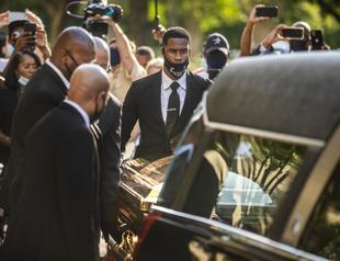 Thousands mourn George Floyd as accused officer appears in court