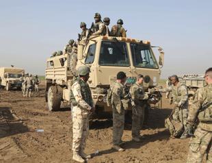 US pledges to reduce Iraq troops as tensions ease