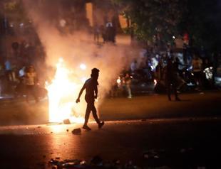 Lebanon to inject dollars as currency plunge revives protest