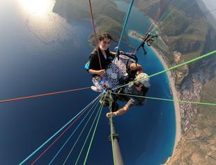 Turkish man paraglides while sipping on coffee