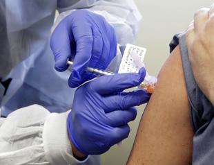 Millions face new virus curbs, but hope rises for US vaccine