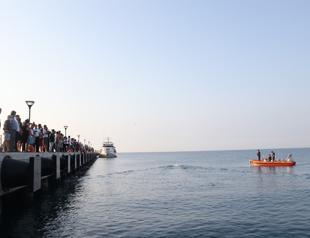 Athletes swim to Turkish Cyprus to draw attention to sports embargoes