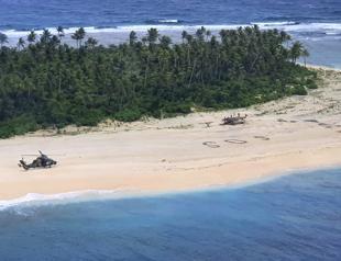 3 men rescued from Pacific island after writing SOS in sand