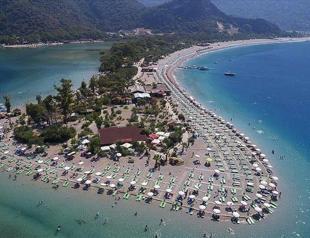 Ölüdeniz beaches dazzle with nature, gliding