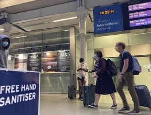 Returning Brits begin quarantine while Russia rolls out vaccine