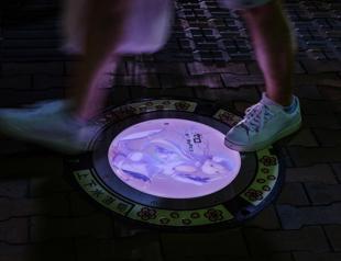 A hole new world: Japan city lights up sewer covers