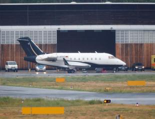 Plane carrying comatose Russian dissident lands in Germany