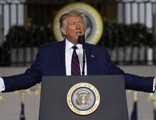 Trump lashes Biden, defies pandemic on White House stage