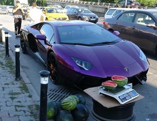 Mysterious man sells watermelons in luxury car