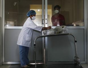 Coronavirus death toll passes 900,000 worldwide