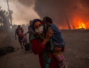 Greece races to shelter migrants after Lesbos camp fire