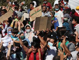 Thousands protest after Greek refugee camp burns down
