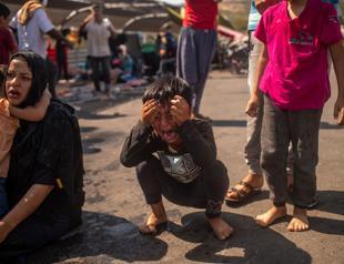 Teargas fired during migrant protests on Greek island of Lesbos