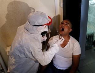 Teams go door-to-door to check on people in isolation