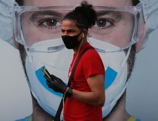 Partial virus lockdown in Madrid as US deaths near 200,000