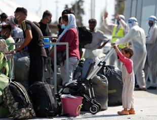 Scores of migrants at new Greek camp contract virus