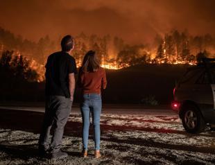 Wildfires rip through California wine country, tens of thousands flee
