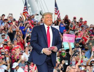 Defiant Trump defends virus record in first post-COVID rally