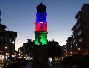 Historical tower lit in colors of Azerbaijani flag