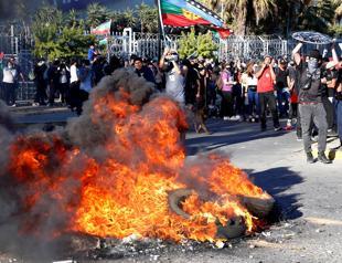 Chile anniversary rallies turn violent as churches burned, police fire tear gas