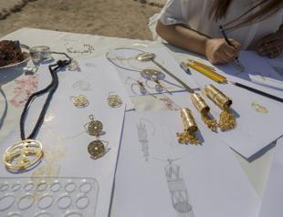 Motifs of ancient artifacts turn into jewelry