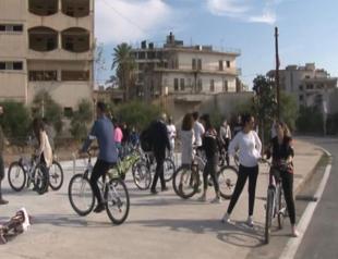 Cypriots cycle through fenced town for first time after 46 years