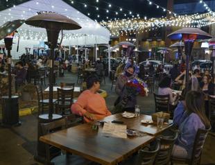 LA shuts restaurants as virus surges, but Europe lockdowns to ease