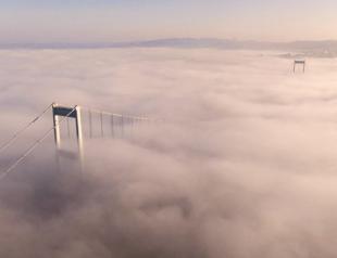 Fog covers Fatih Sultan Mehmet Bridge in Istanbul