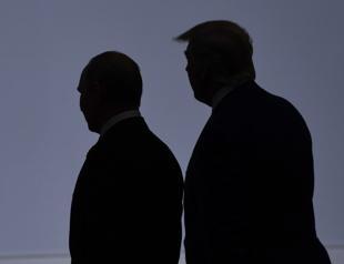 Trump says cyberattack under control, plays down Russian role